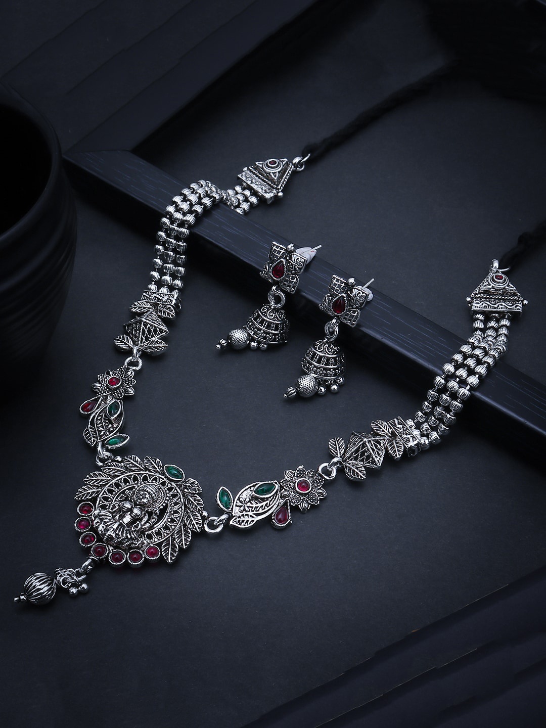 

Sukkhi Oxidised Rhodium-Plated Silver-Toned Green & Red Stone-Studded Jewellery Set