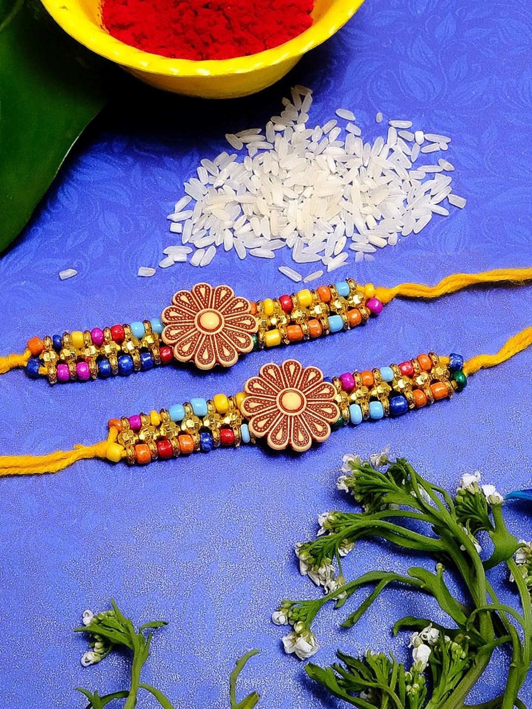 

Crunchy Fashion Men Set of 2 Yellow & Red Beaded Floral Design Rakhis