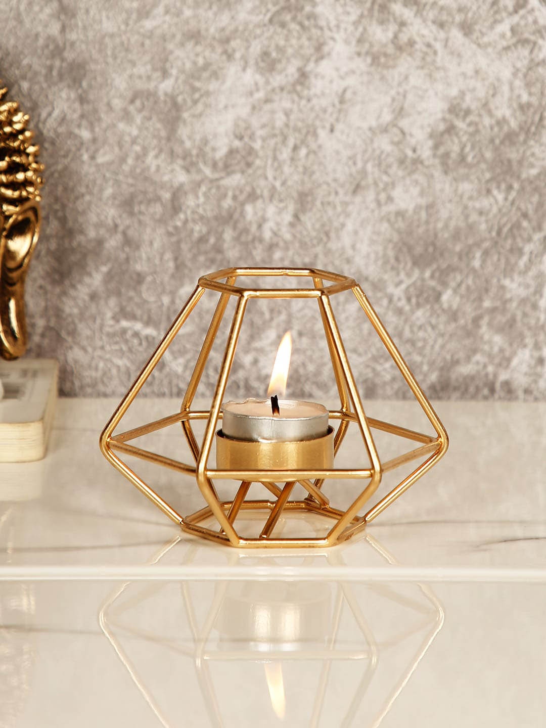 

CraftVatika Gold-Toned Tealight Candle Holder Showpiece