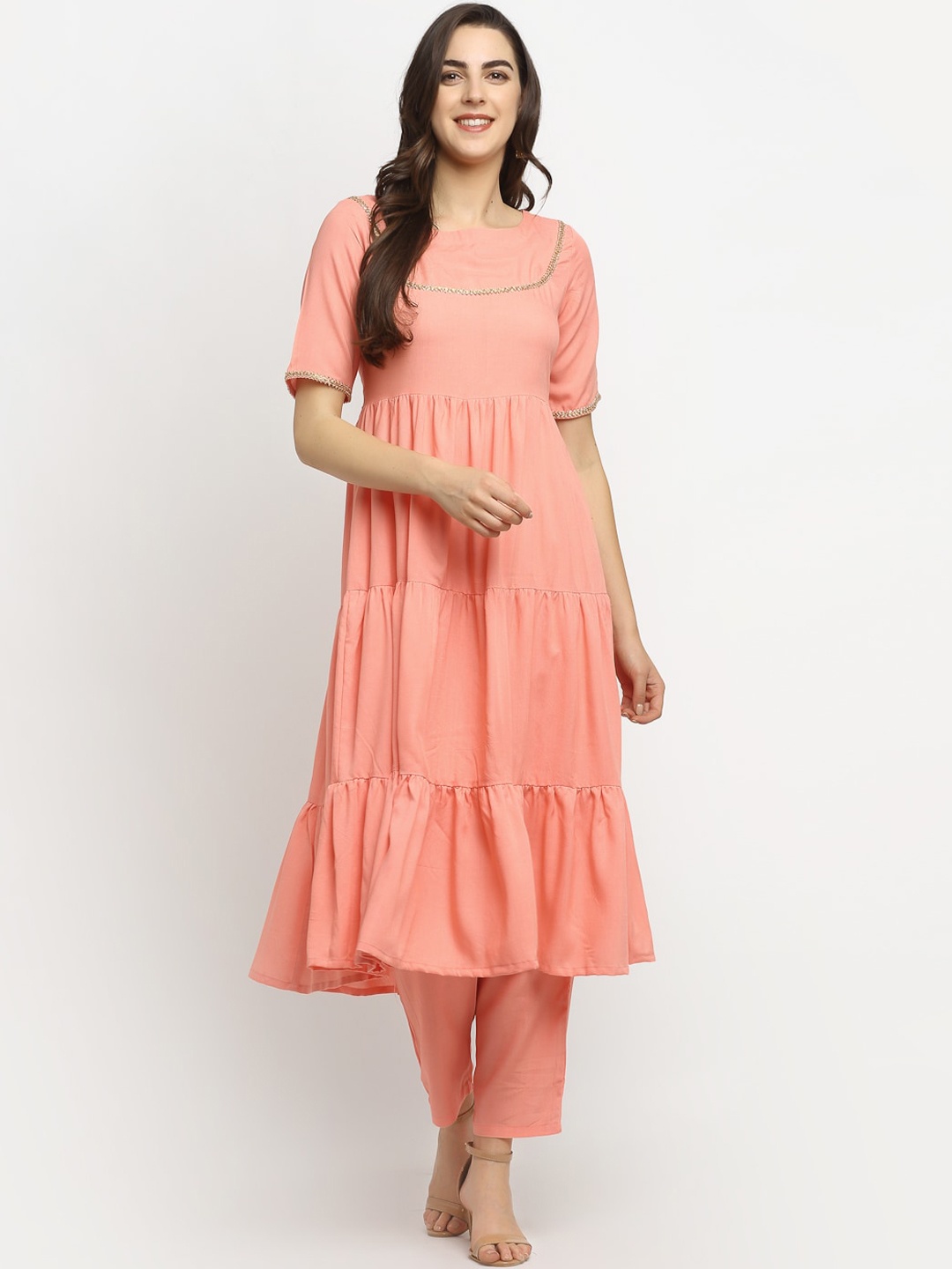 

Rudra Bazaar Women Peach-Coloured Tiered A-Line Kurti with Trousers