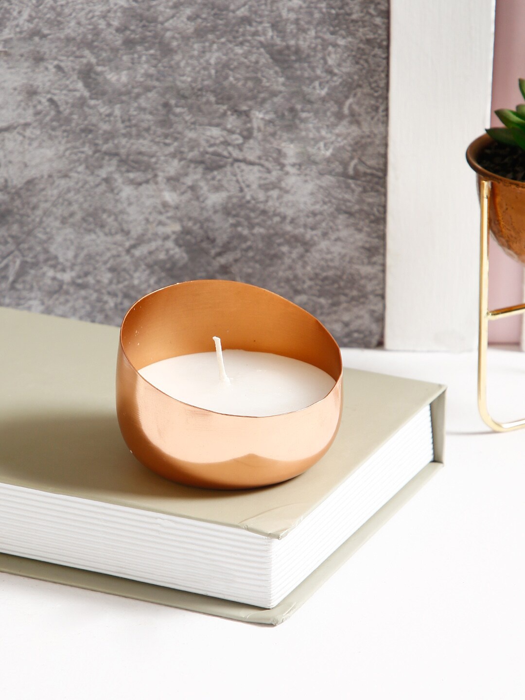 

Aapno Rajasthan Copper-Toned Handcrafted Candle Holder