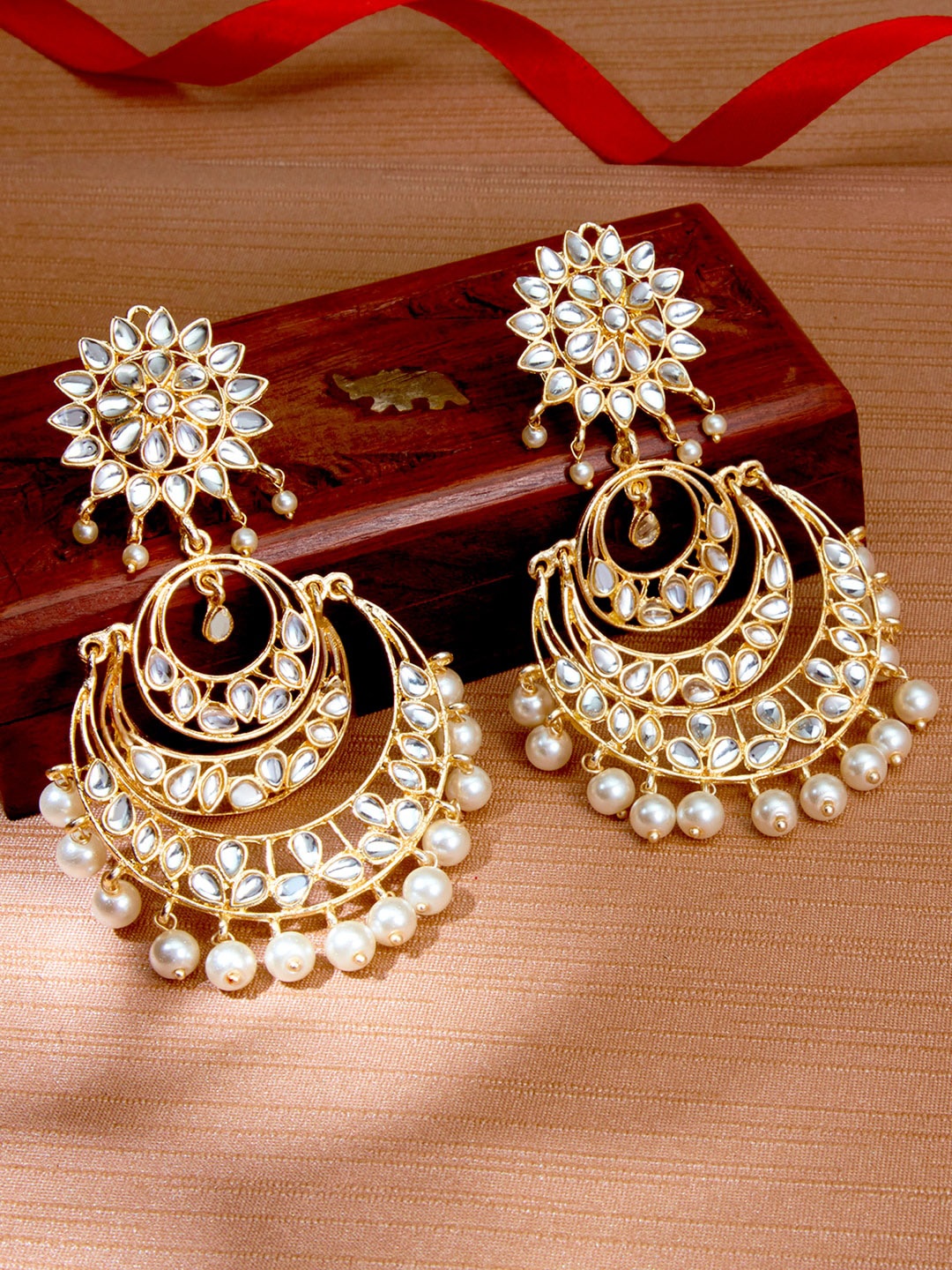 

Sukkhi White Gold-Plated Kundan Studded Crescent Shaped Chandbalis