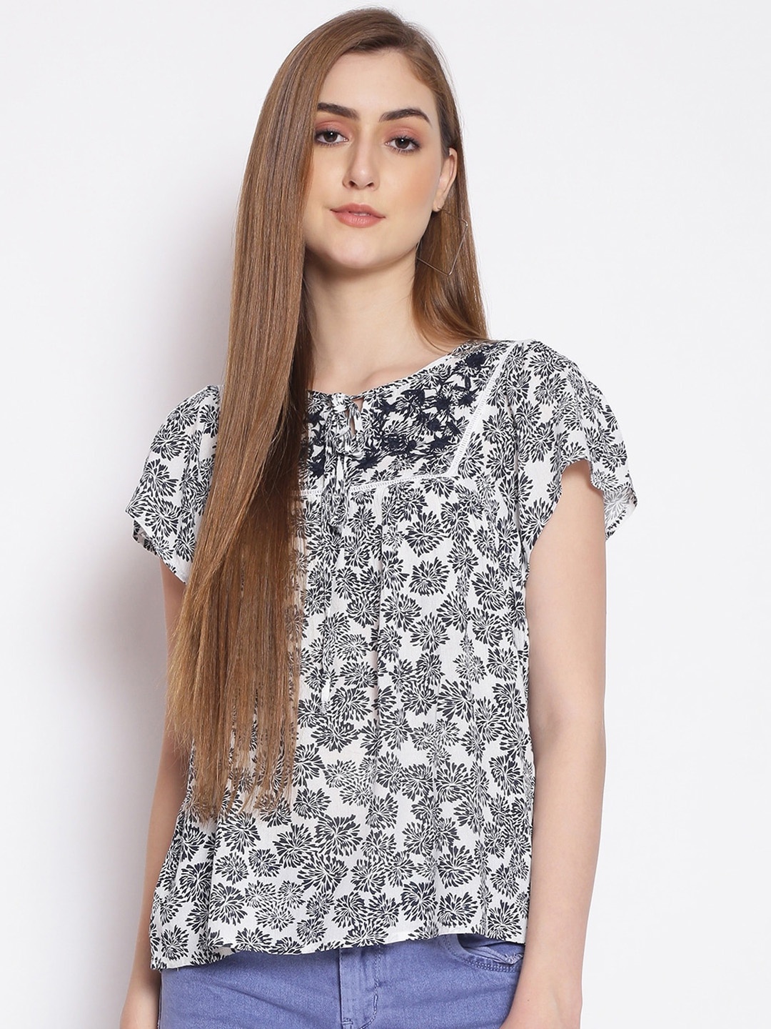 

Oxolloxo White & Navy Blue Floral Tie-Up Neck Crepe Regular Top