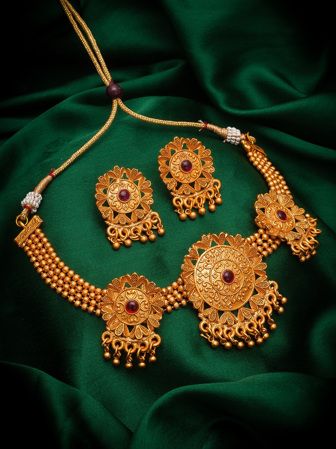 

aadita Gold-Toned & Pink Ruby-Studded & Ghungroo Beaded Temple Jewellery Set