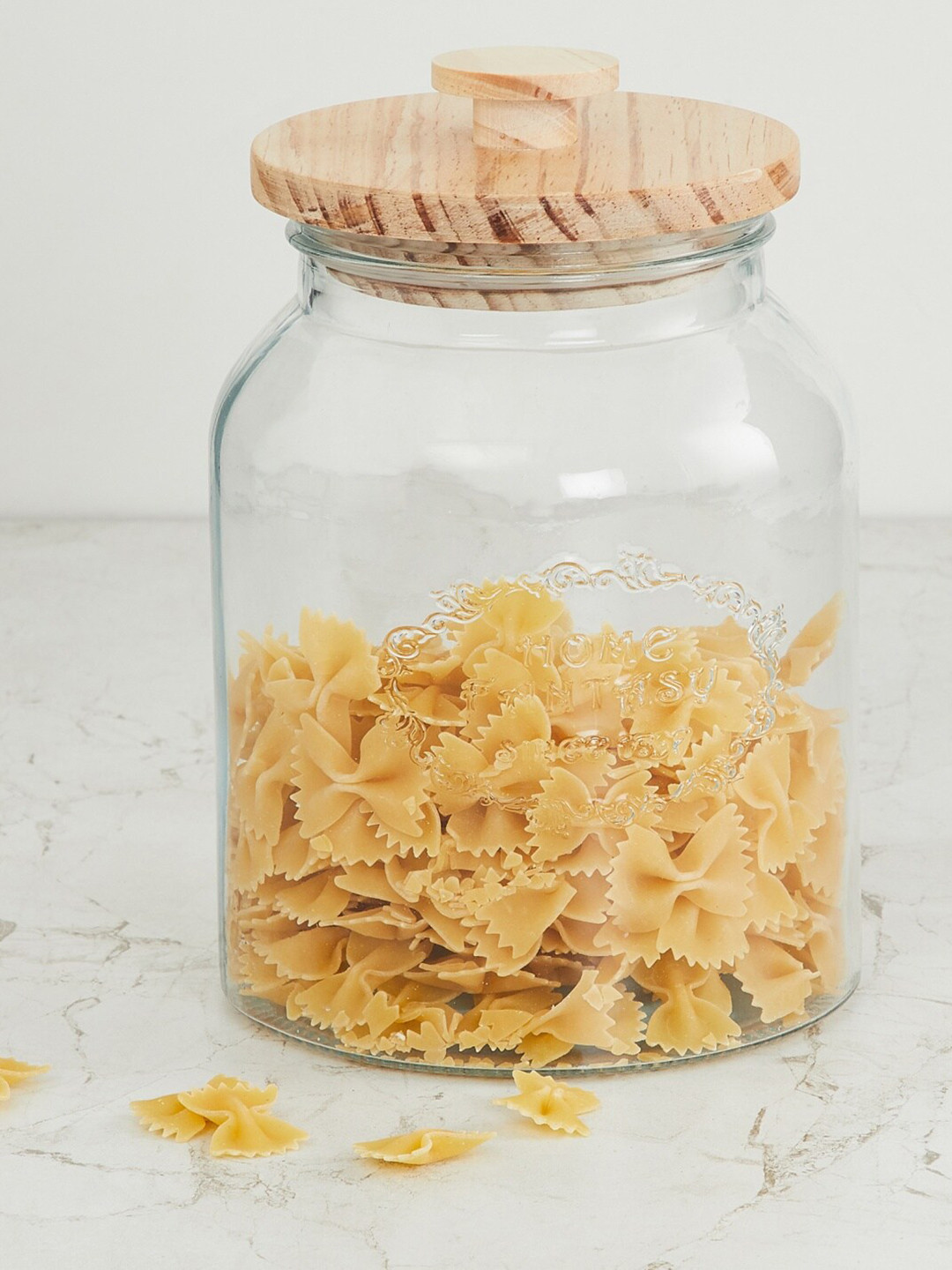 

Home Centre Transparent Solid Glass Storage Jar With Wooden Lid