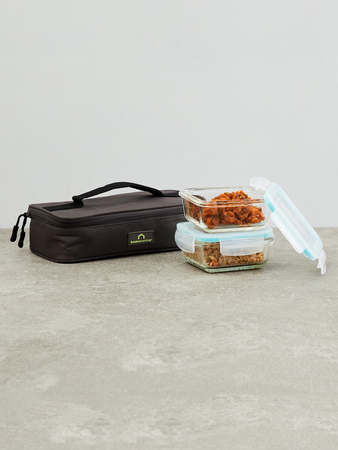 

Home Centre Set Of 2 Transparent Solid Glass Food Containers with Lunch Bag
