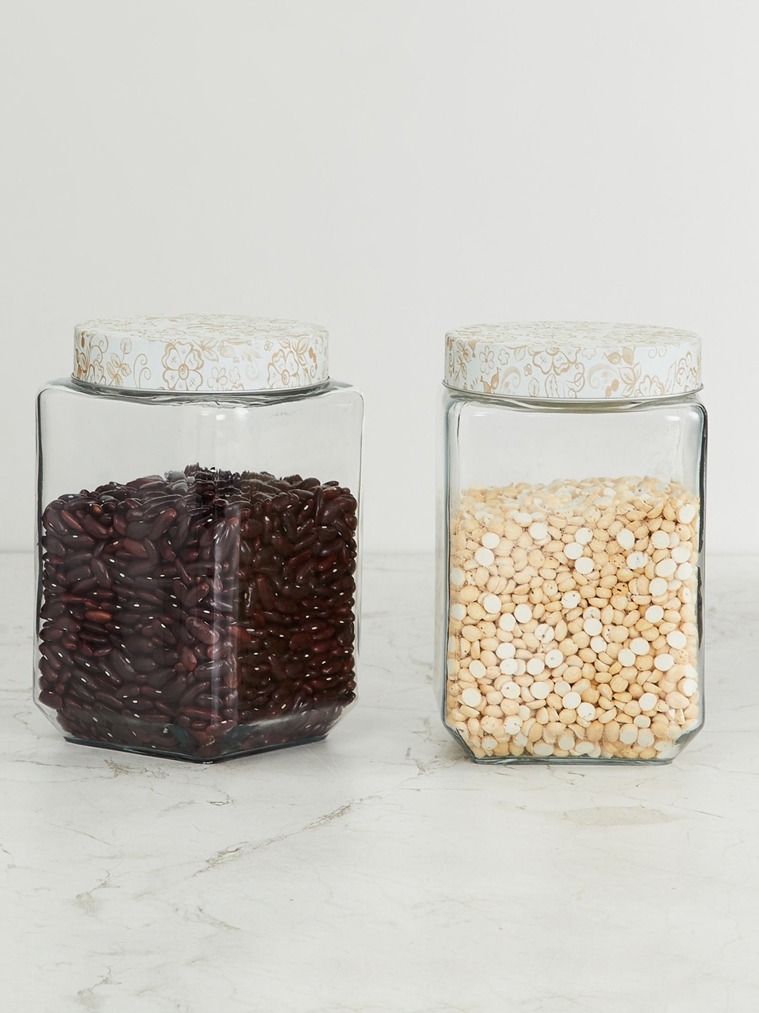 

Home Centre Set of 2 Transparent & White Glass Storage With Metal Floral Lid
