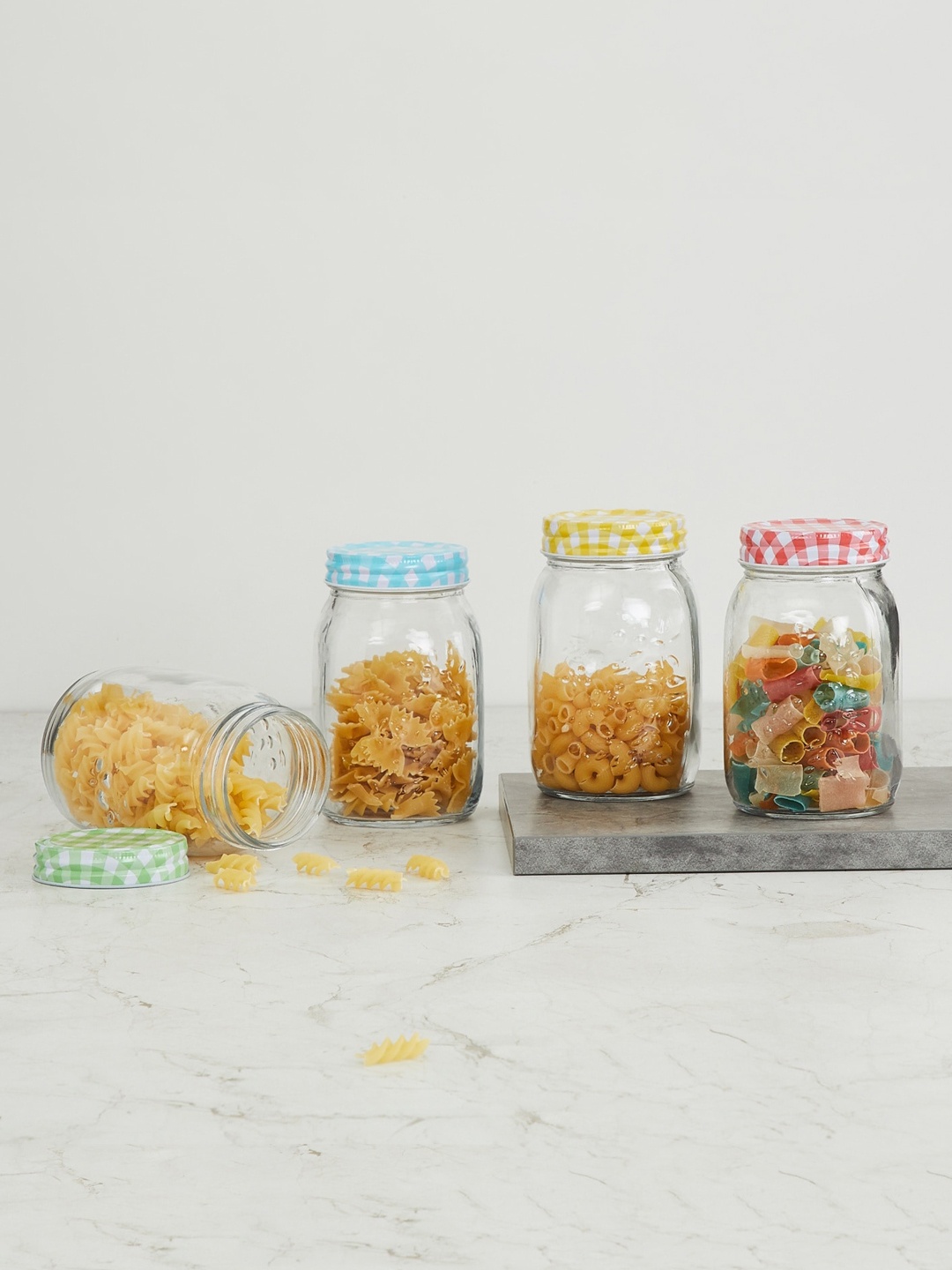 

Home Centre Set Of 4 Transparent Solid Glass Jars With Lid