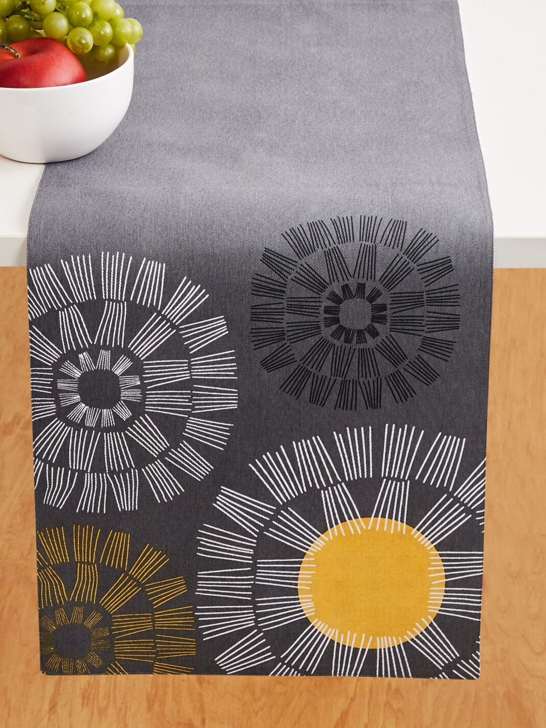 

Home Centre Grey & Yellow Meadows Sketches Printed Cotton Rectangular Reversible Table Runner