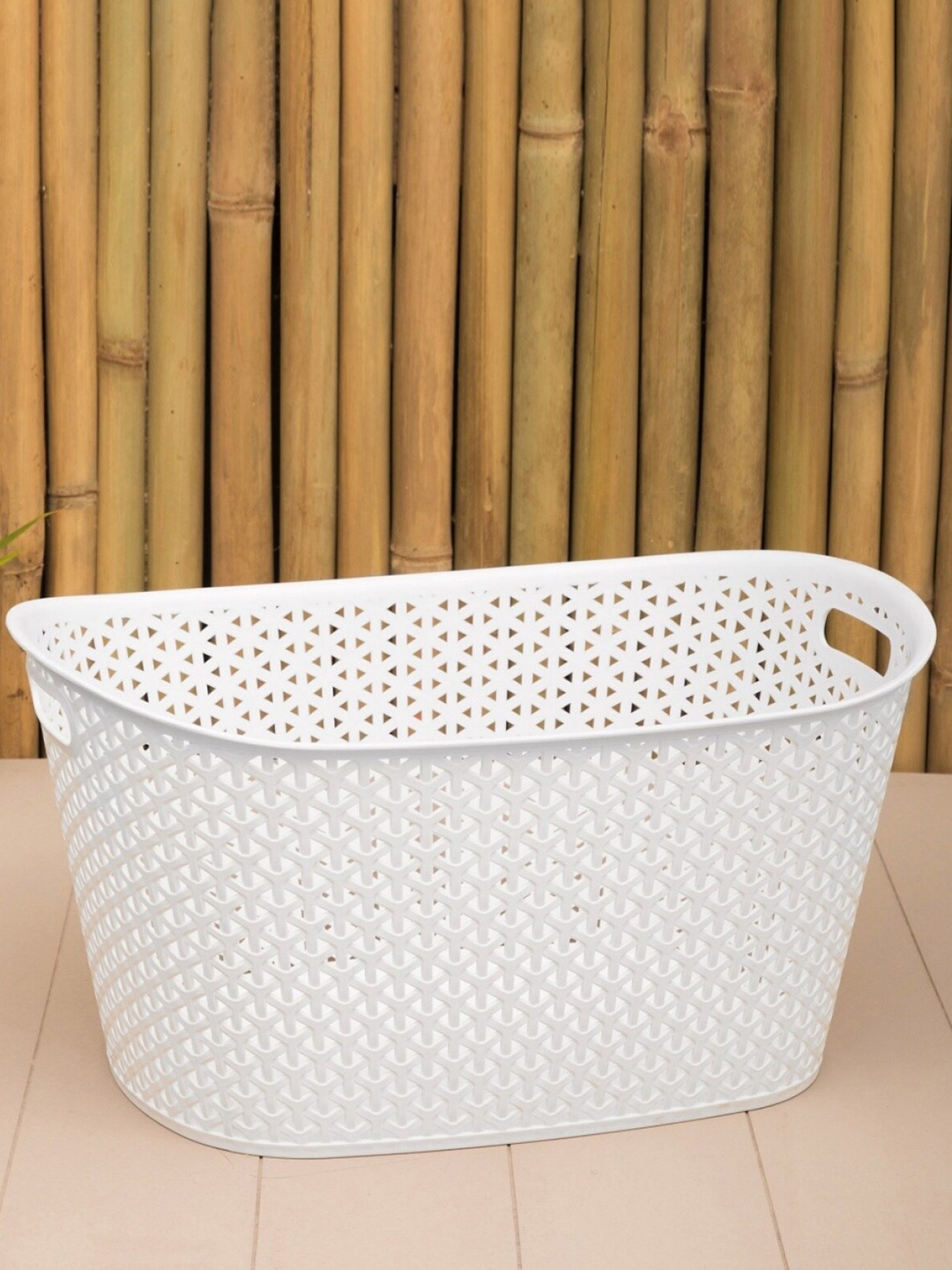 

Home Centre White Textured Oval Open Storage Basket