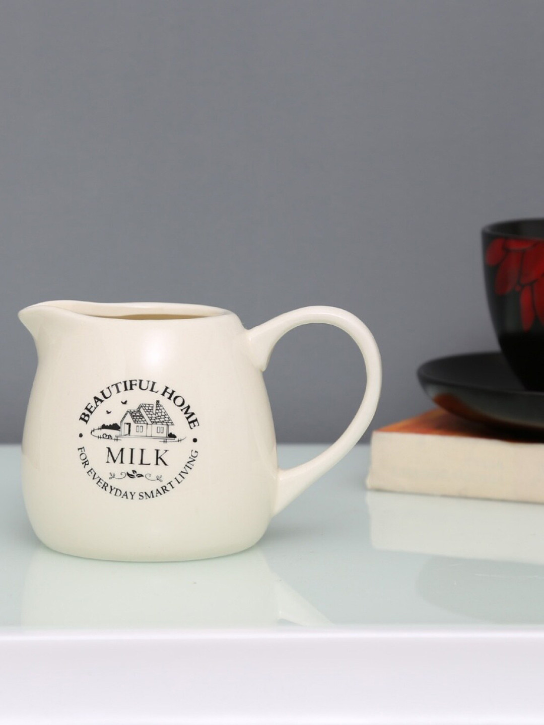 

Home Centre White Beautiful Home Printed Ceramic Milk Pot 320 ml