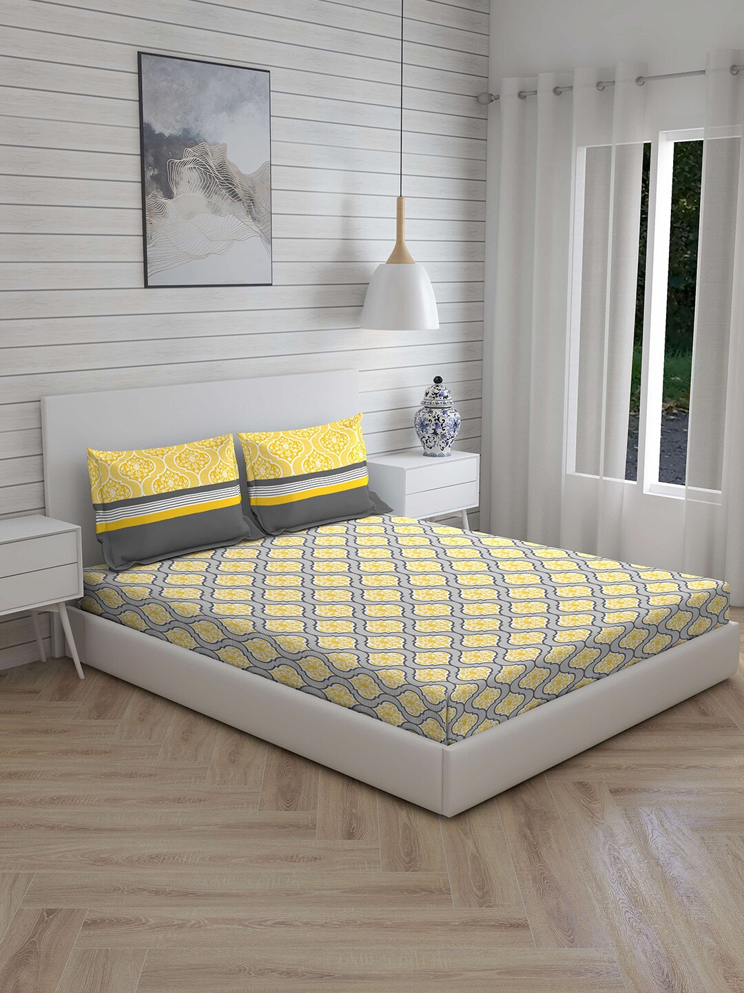 

Layers White & Grey Floral 104 TC Cotton 1 Queen Bedsheet with 2 Pillow Covers