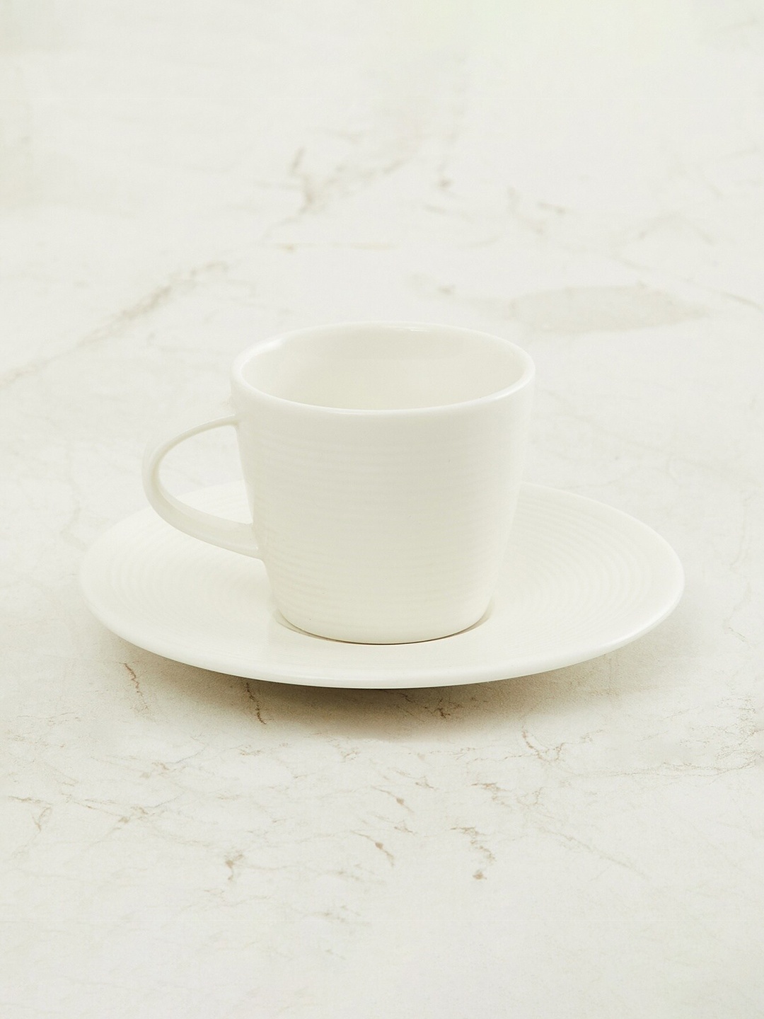 

Home Centre White Textured Porcelain Espresso Cup And Saucer Set