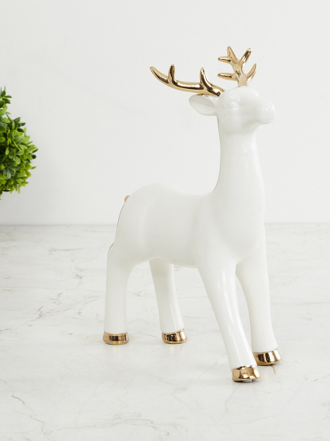 

Home Centre White & Rose Gold-Toned Brighton Ceramic Standing Reindeer Figurine Showpiece