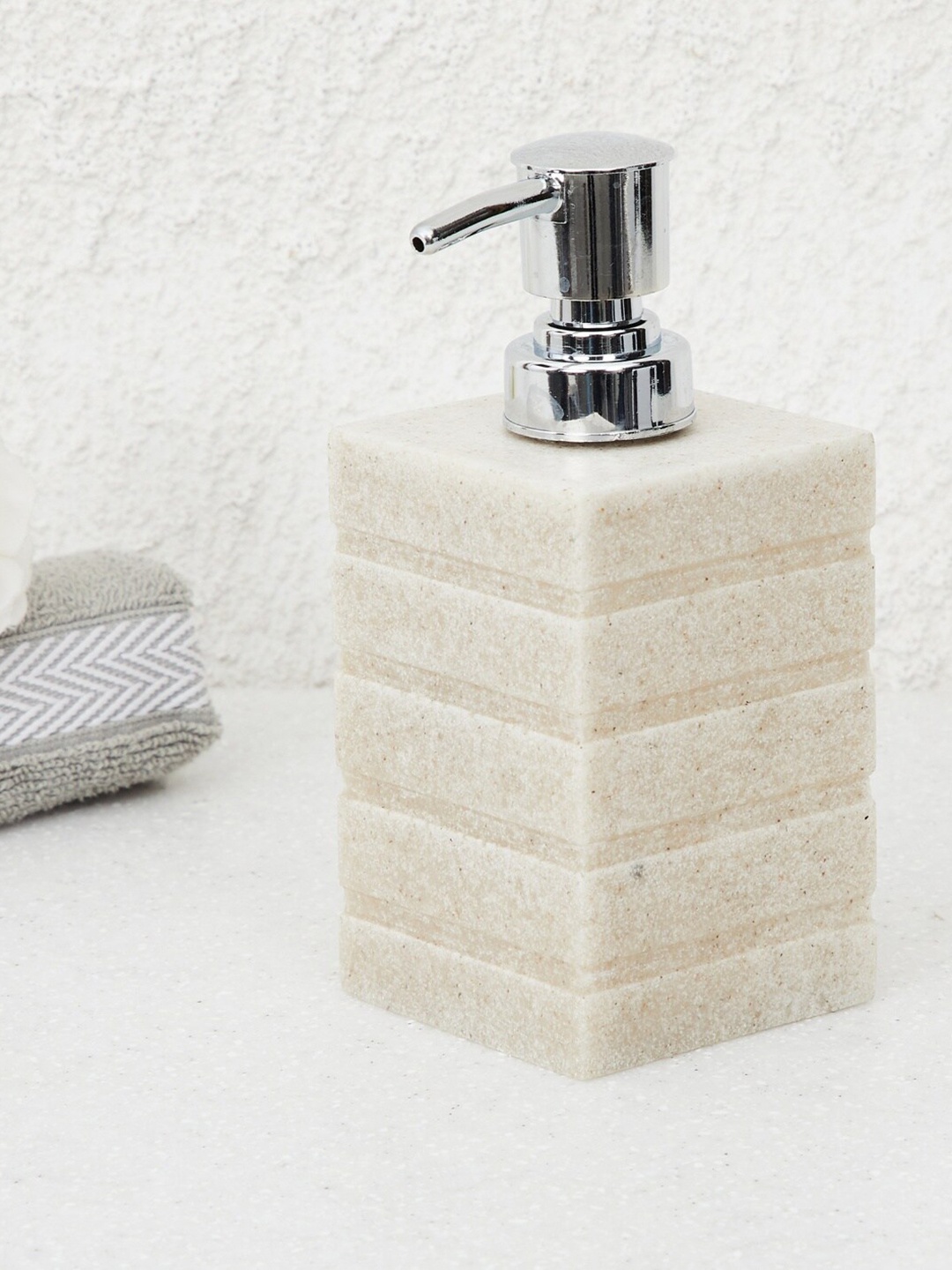 

Home Centre Beige Striped Carter Textured Soap Dispenser