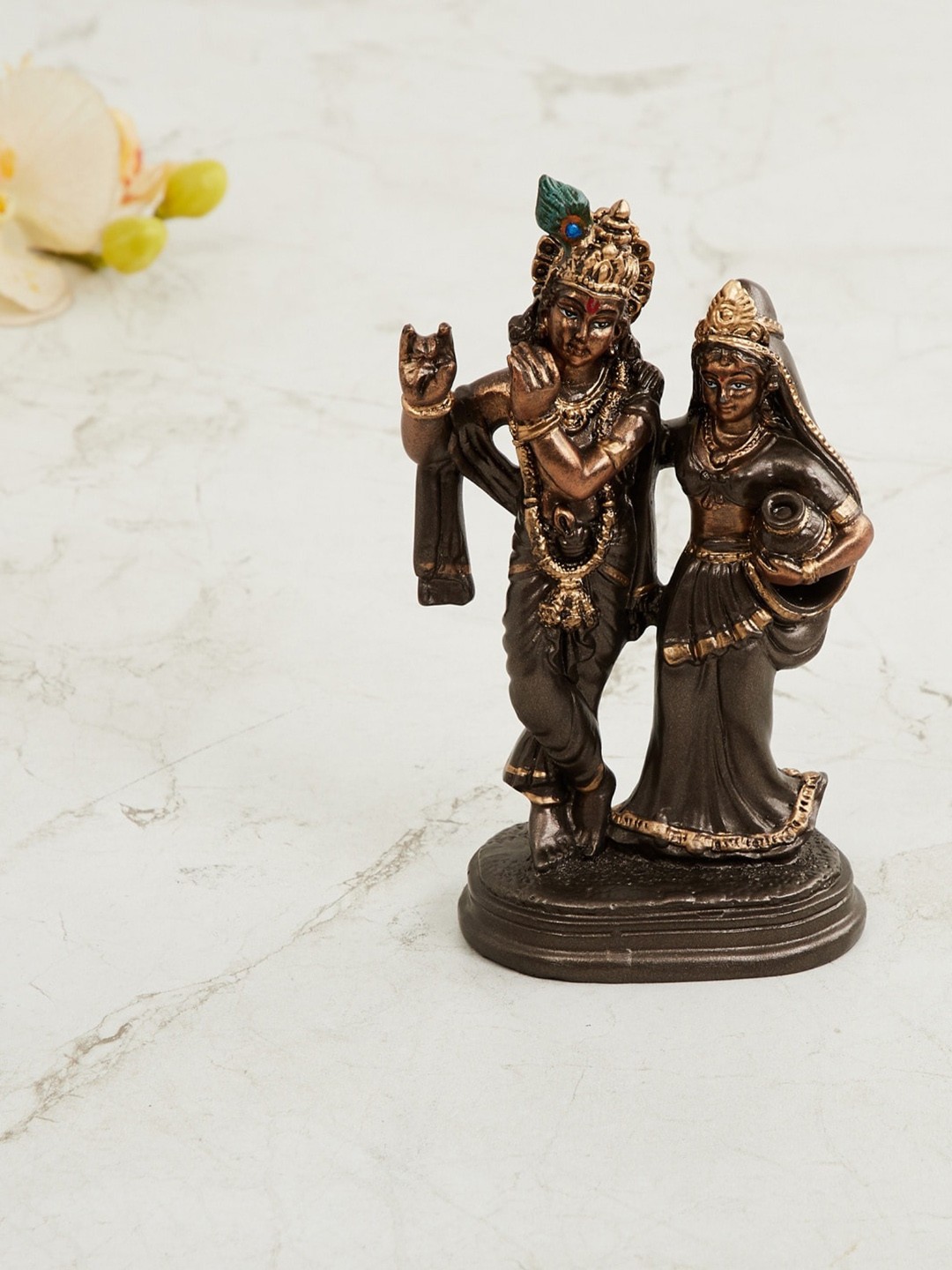

Home Centre Brown & Gold-Toned Radha Krishna Figurine Showpieces