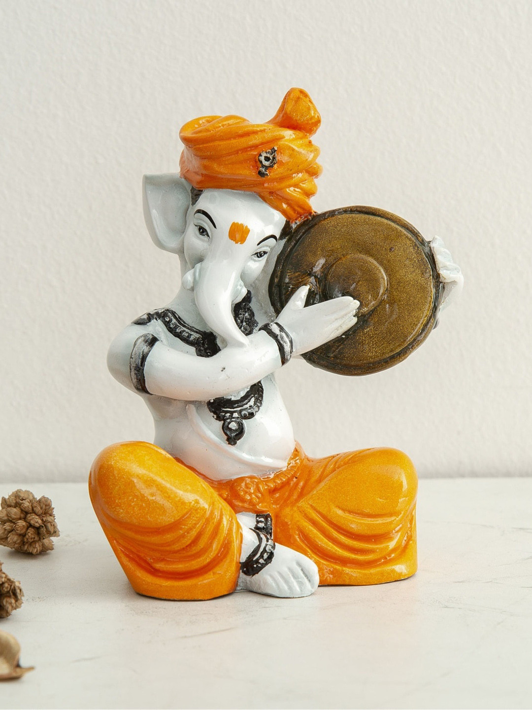 

Home Centre White & Orange Polyresin Ganesha Figurine Showpiece
