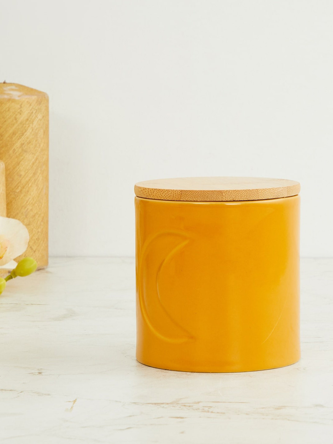 

Home Centre Yellow Textured Decorative Cannister With Lid