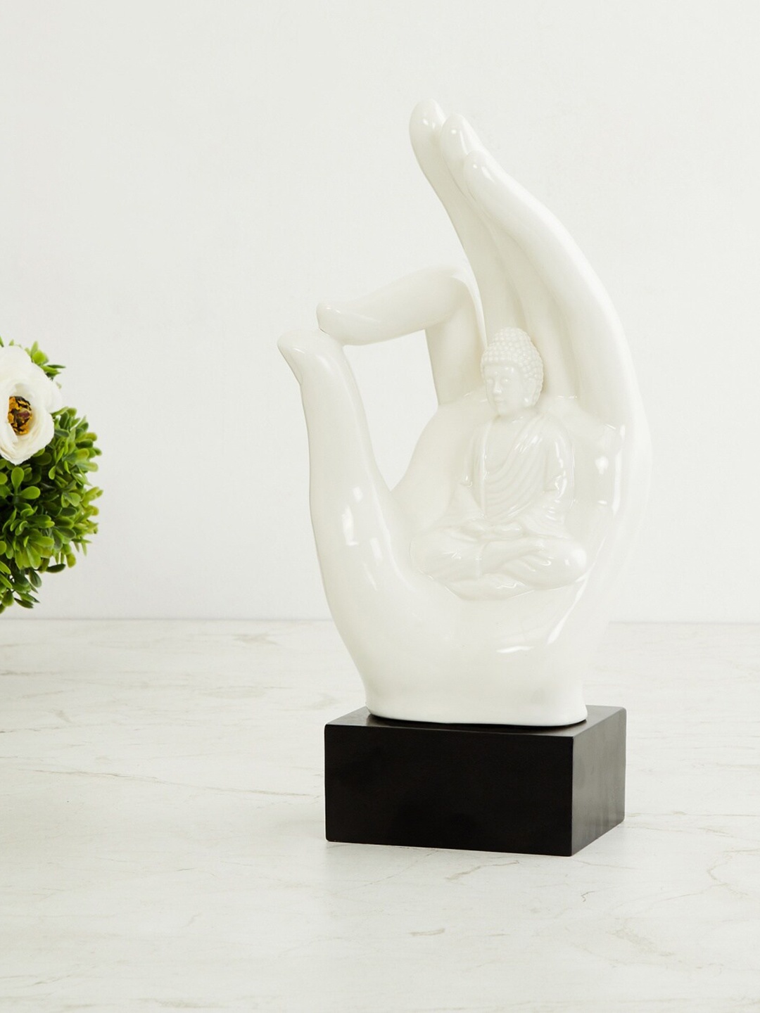 

Home Centre White & Black Ceramic Buddha Hand Figurine Showpiece