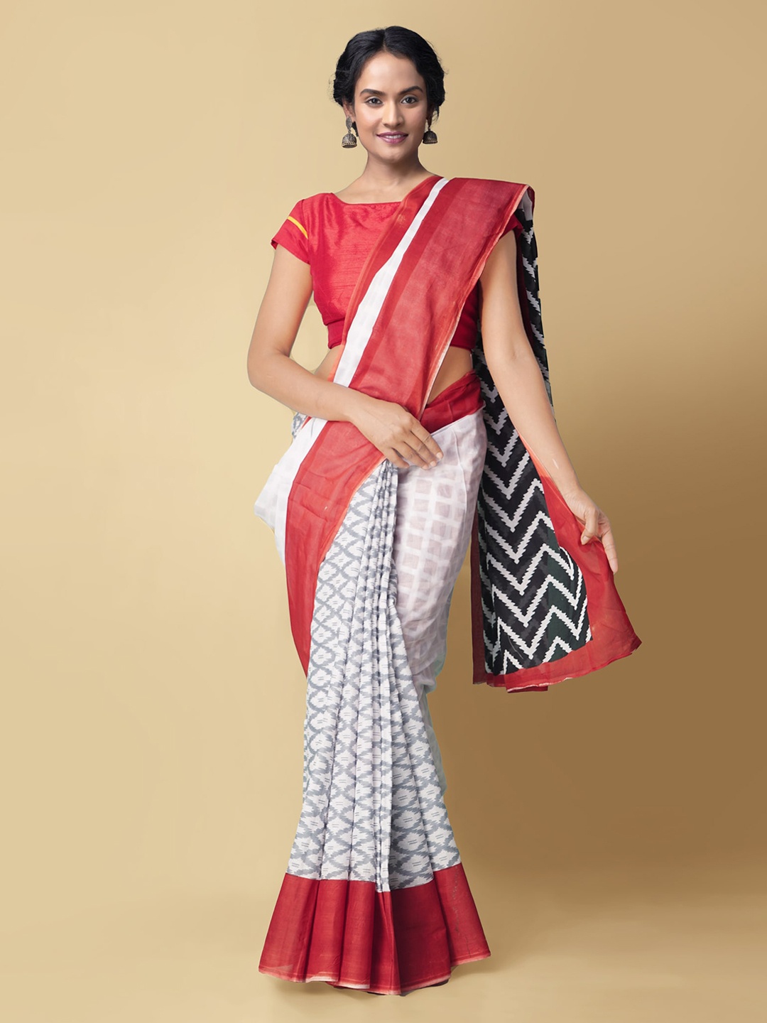 

Unnati Silks White & Red Pure Cotton Pochampally Saree