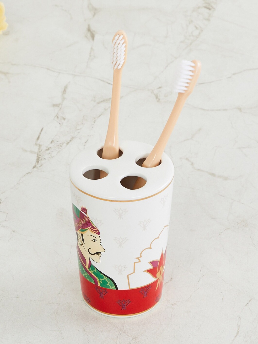 

Home Centre White & Red Raja Rani Printed Ceramic Tooth Brush Holder