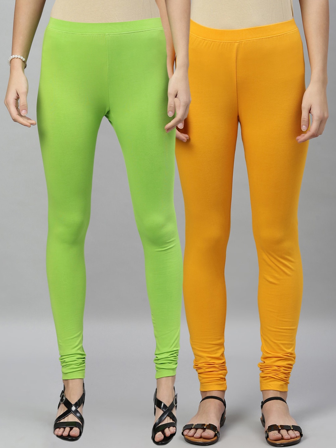 

Kryptic Women Pack of 2 Solid Churidar-Length Leggings, Mustard