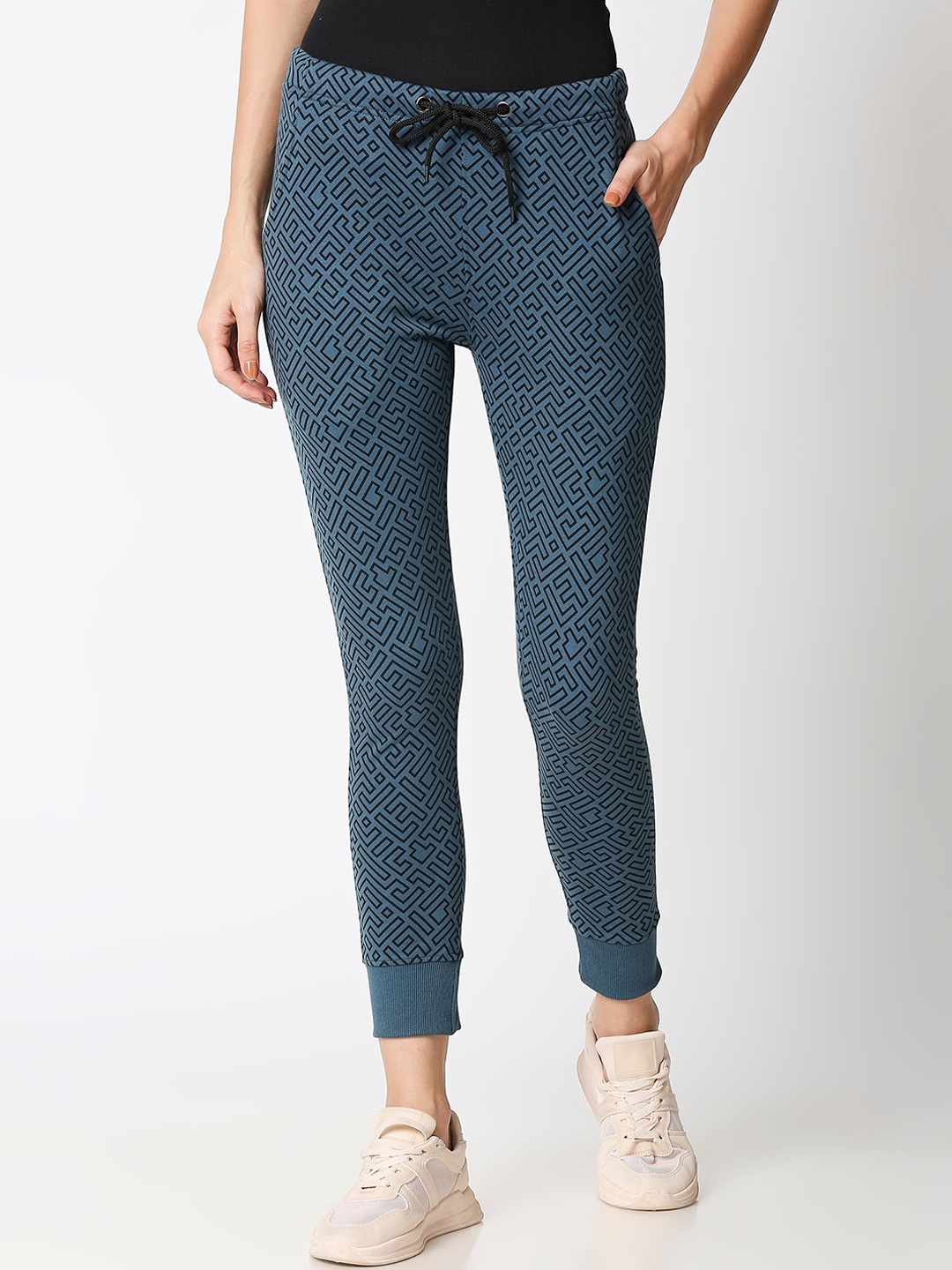 

Bewakoof Women Teal Blue & Black Printed Unending Maze AOP Joggers