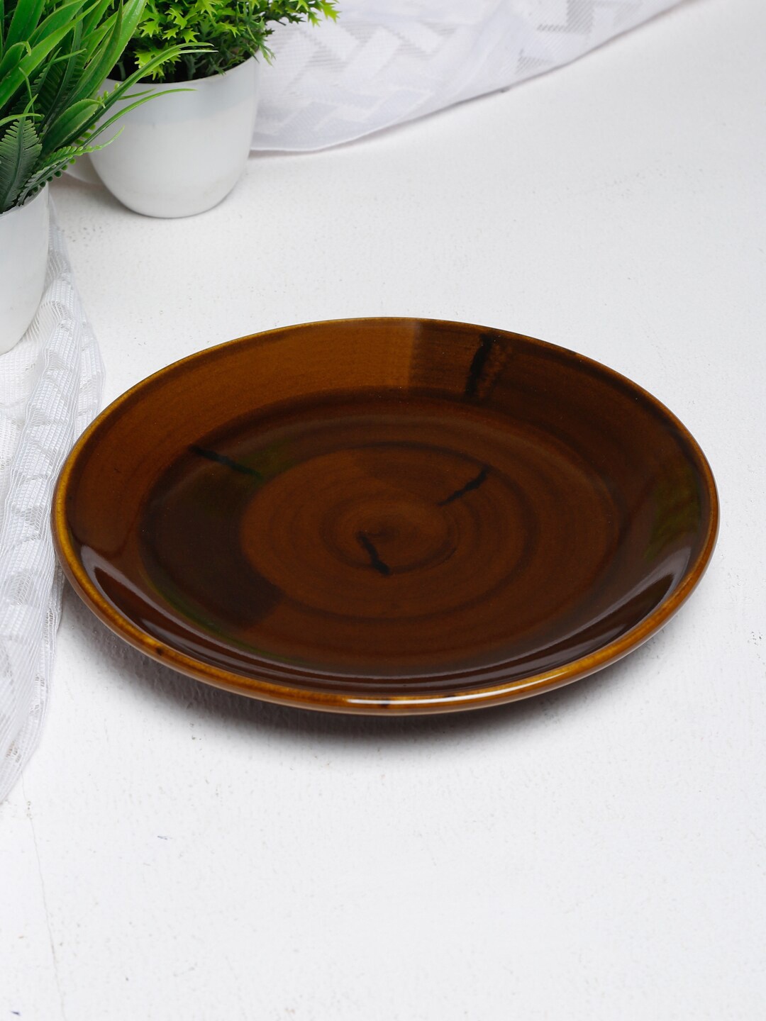 

Fabindia Brown & 1 Pieces Textured Ceramic Glossy Plates