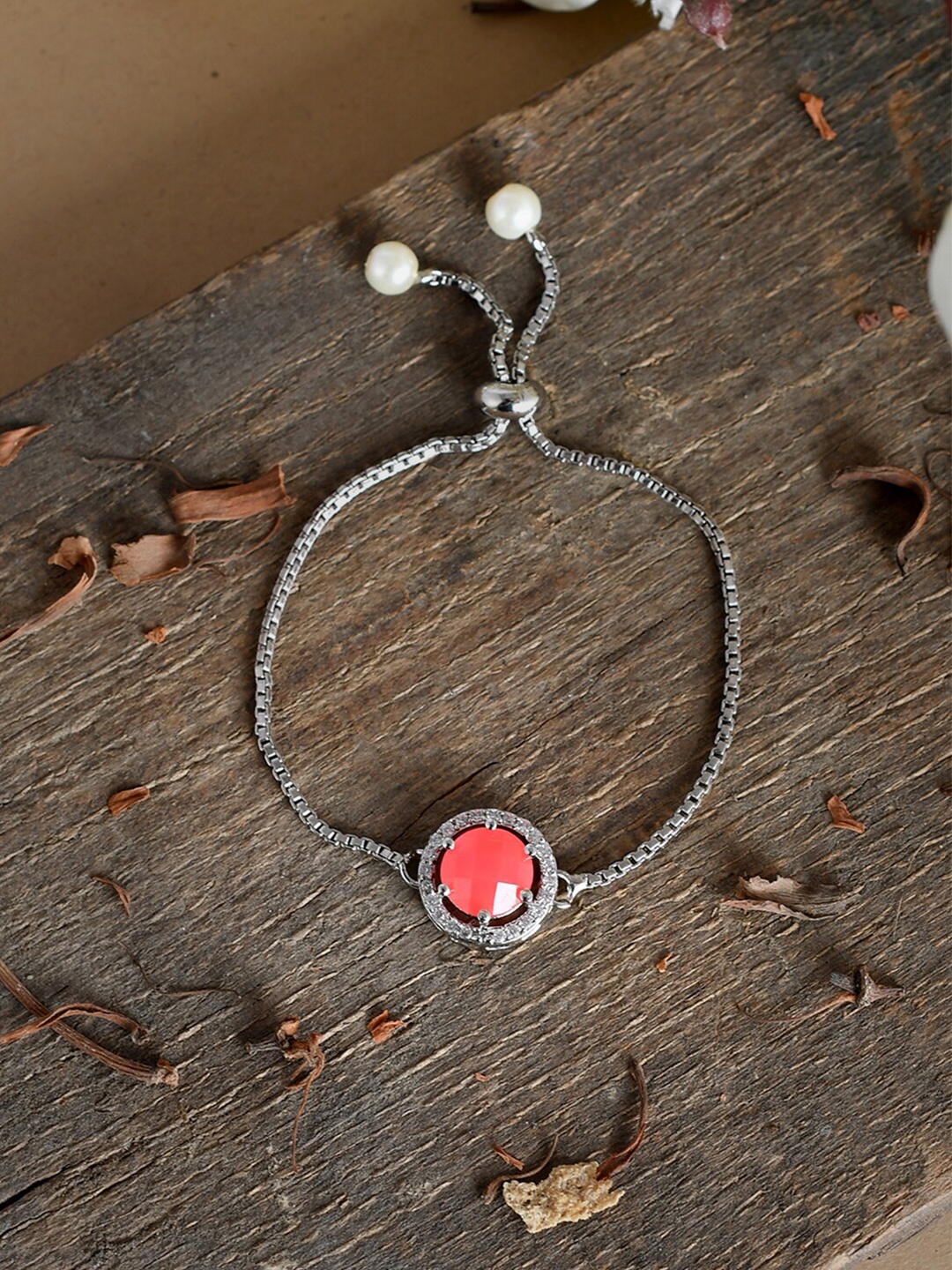 

Silvermerc Designs Women Silver & Orange Brass American Diamond Charm Bracelet