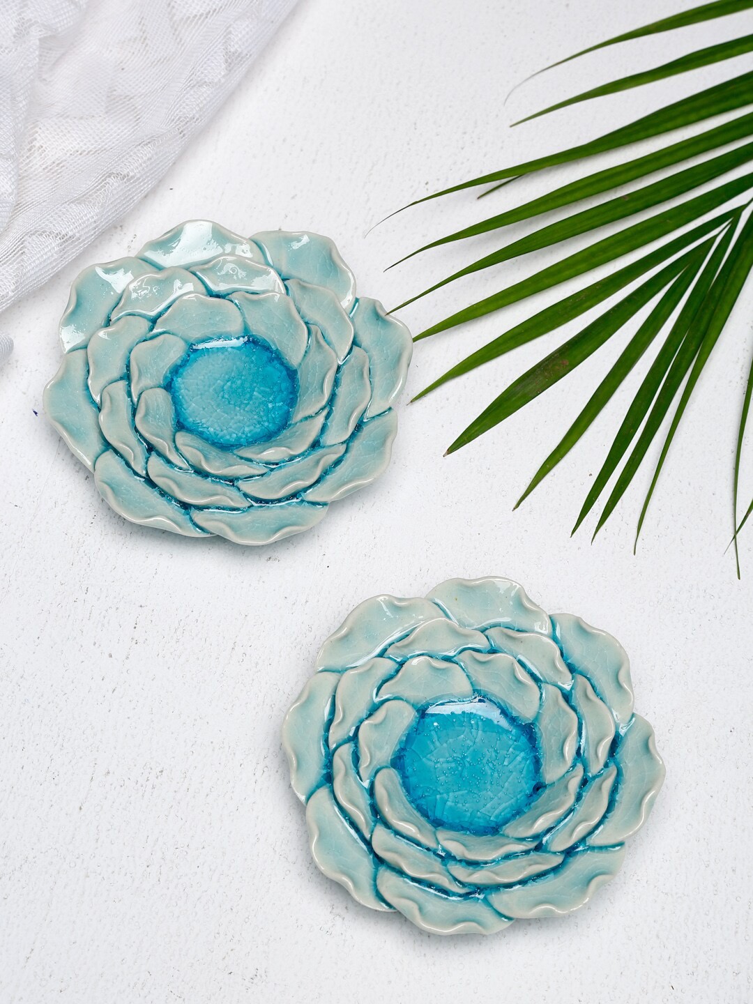 

Fabindia Set Of 2 Blue Ceramic Flower Shaped Tea Light Candle Holder