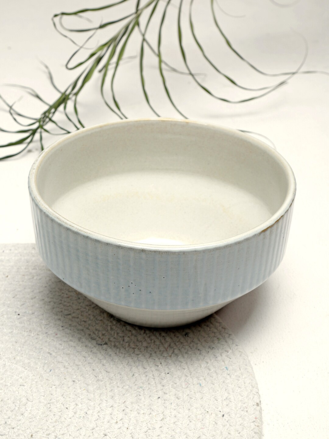 

Fabindia White & Blue Textured Ceramic Glossy Bowl