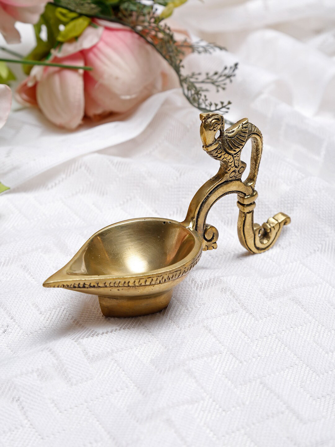 

Fabindia Gold-Toned Bird Textured Oil Lamp