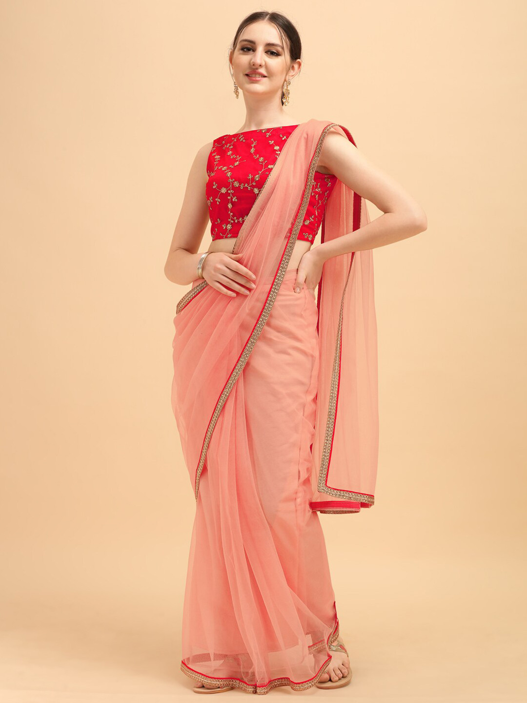 

Sangria Pink Sequinned Net Saree