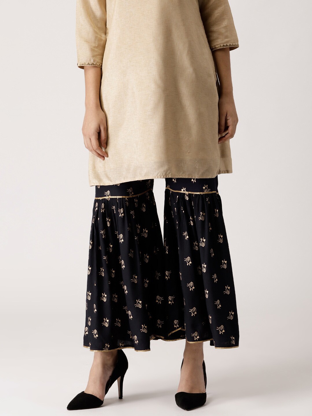 

Libas Women Black & Beige Floral Printed Knitted Ethnic Palazzos