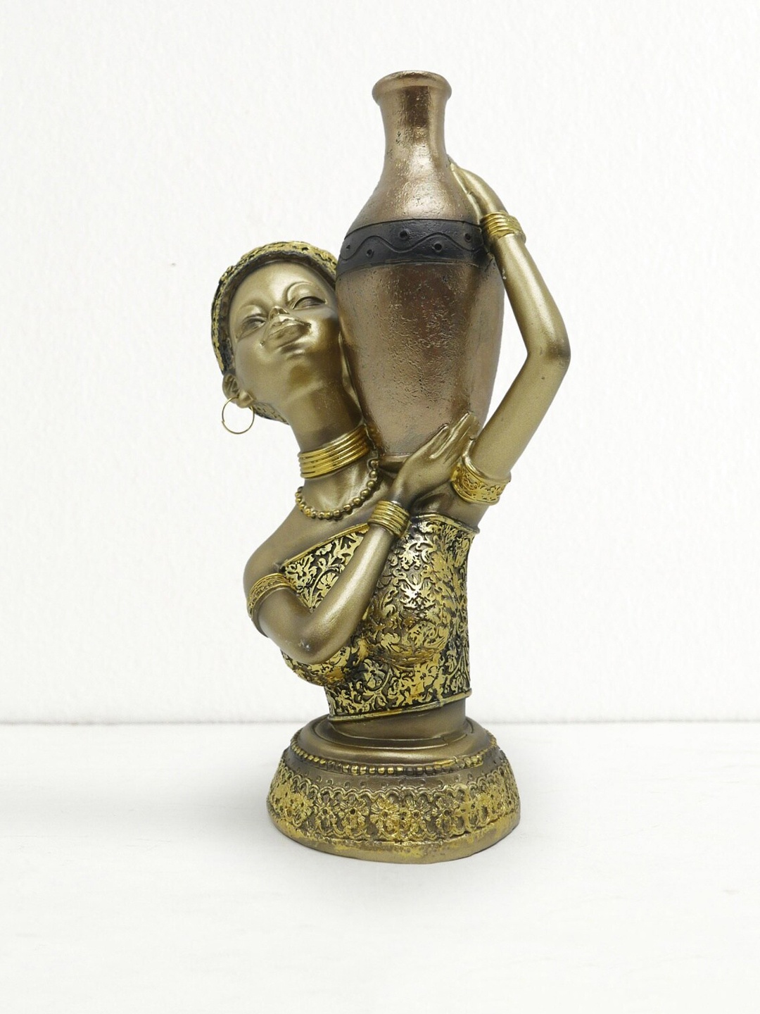 

Home Centre Gold-Toned Corsica African Figurine Showpiece