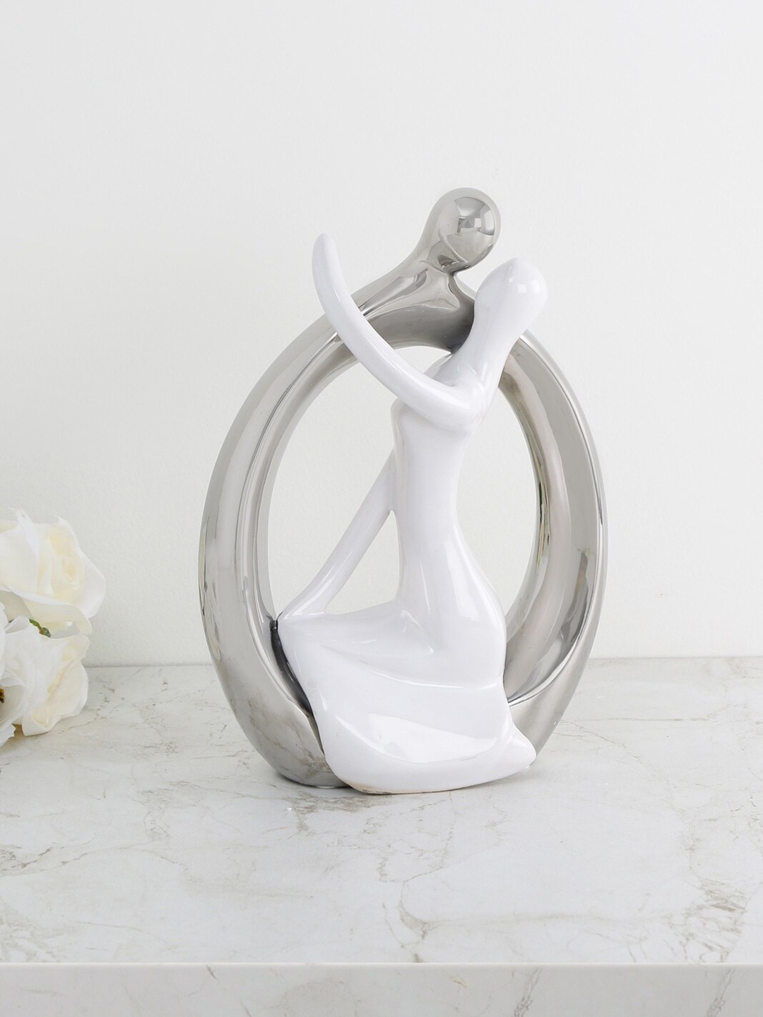 

Home Centre Silver-Toned & White Galaxy Ceramic Contemporary Couple Figurine Showpiece