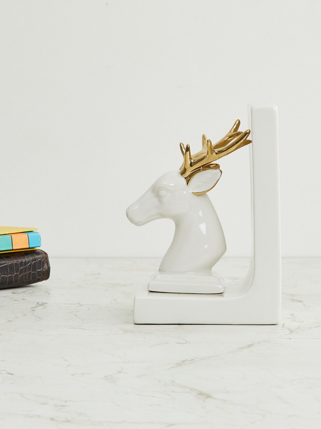 

Home Centre White & Gold-Toned Langford Reindeer Bookend Ceramic Showpiece
