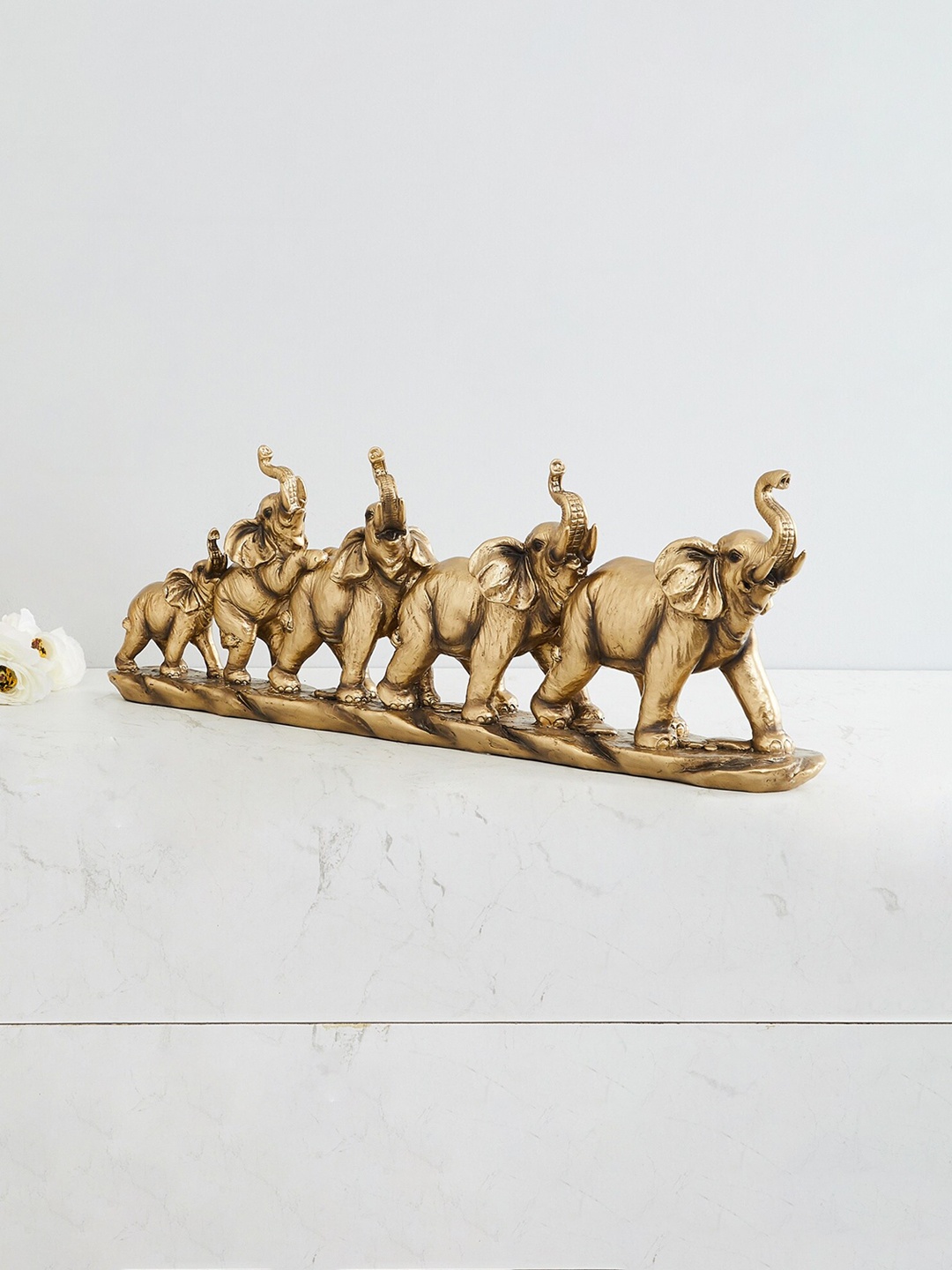 

Home Centre Gold-Toned Jaguar Five Elephants Parade Figurine Showpiece