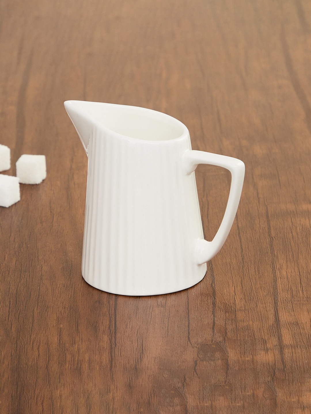 

Home Centre White Solid Ceramic Glossy Alamode Ceramic Creamer