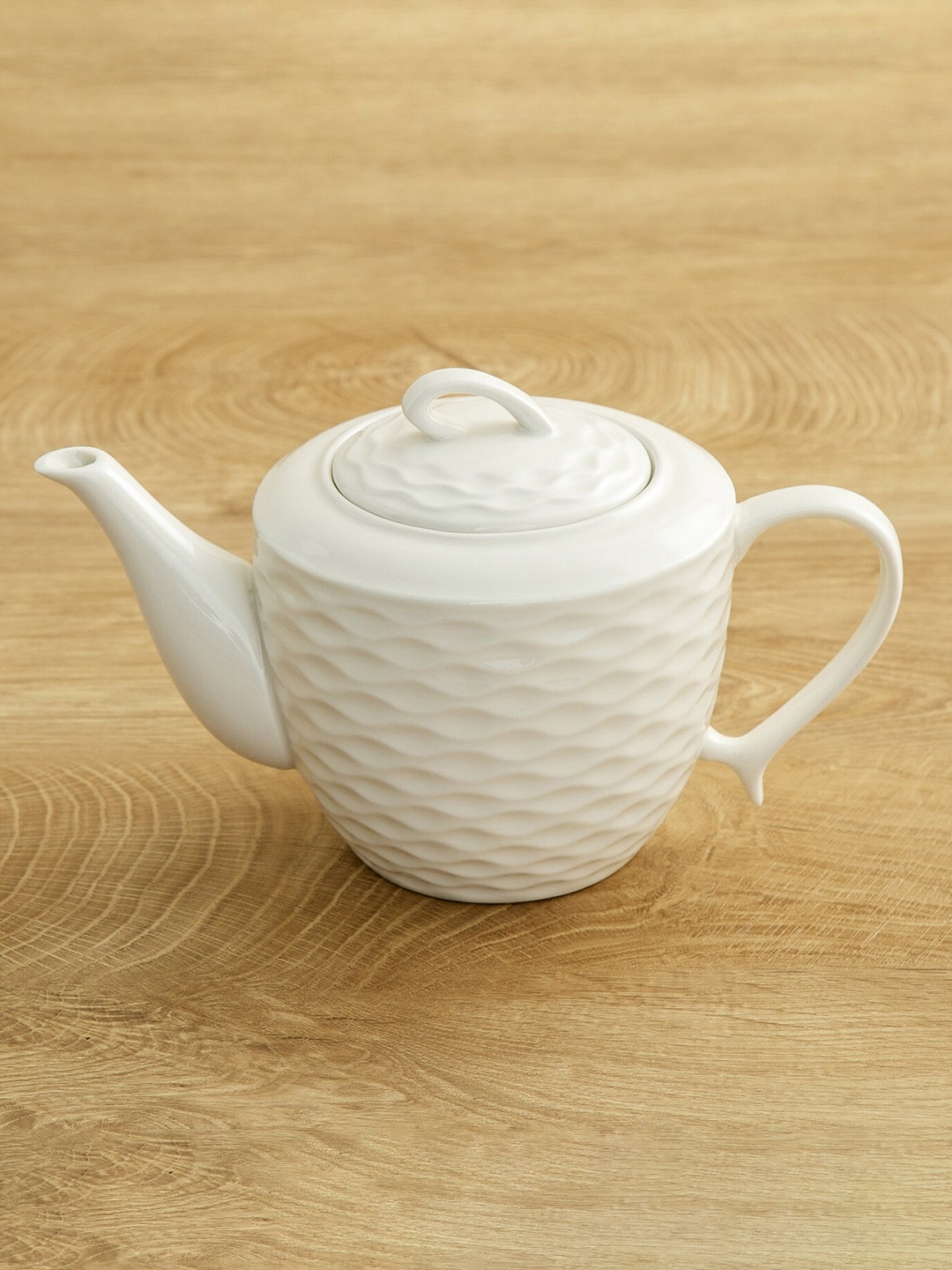 

Home Centre White Textured Ceramic Glossy Kettle