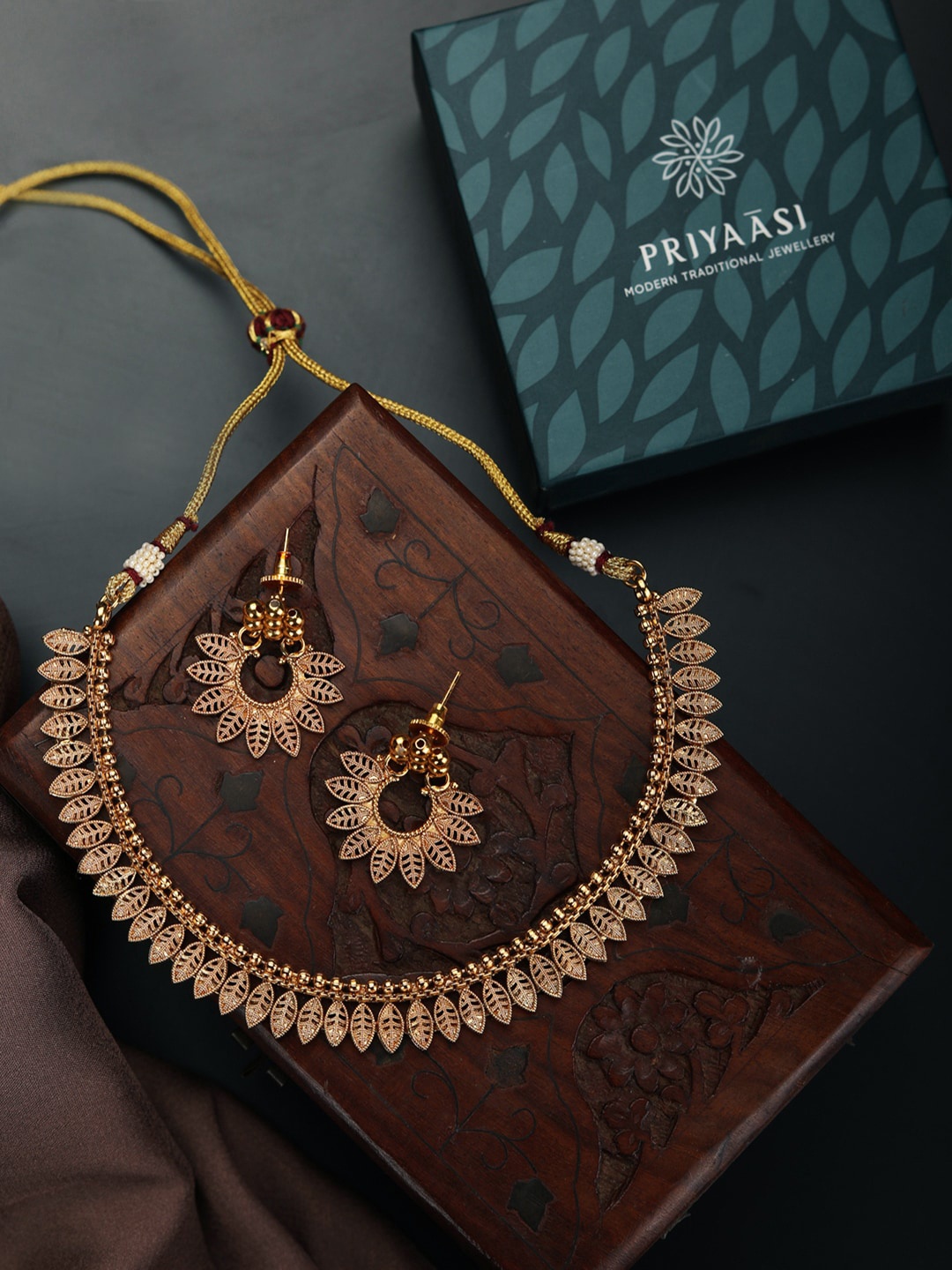 

Priyaasi Gold-Plated Leaf Patterned Handcrafted Jewellery Set