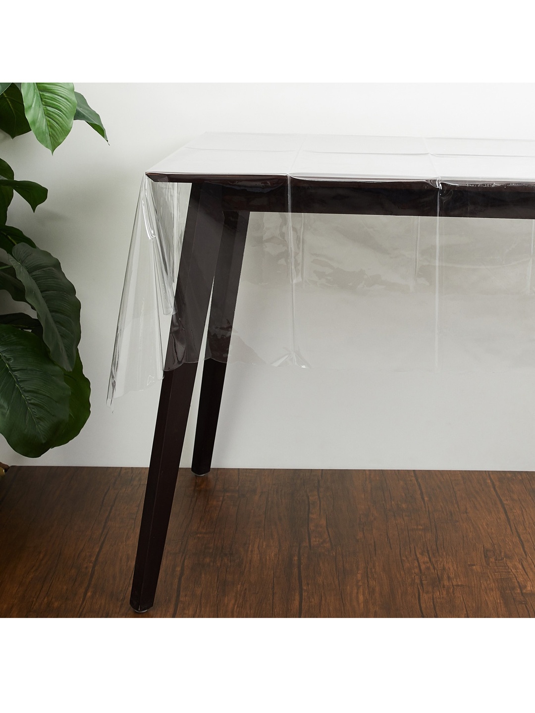 

Home Centre White & Transparent Solid 6-Seater Table Cover