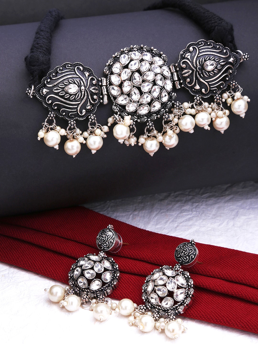 

Yellow Chimes Oxidized Silver-Plated & White Stone-Studded Choker Jewellery Set