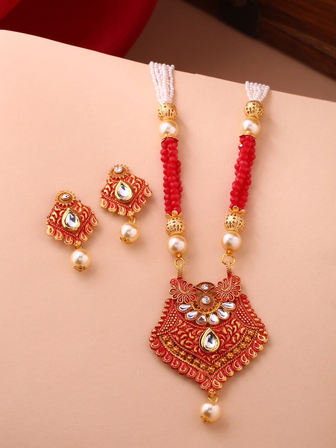 

Shoshaa Gold-Plated Red Artificial Stones & Beads-Studded Handcrafted Jewellery Set