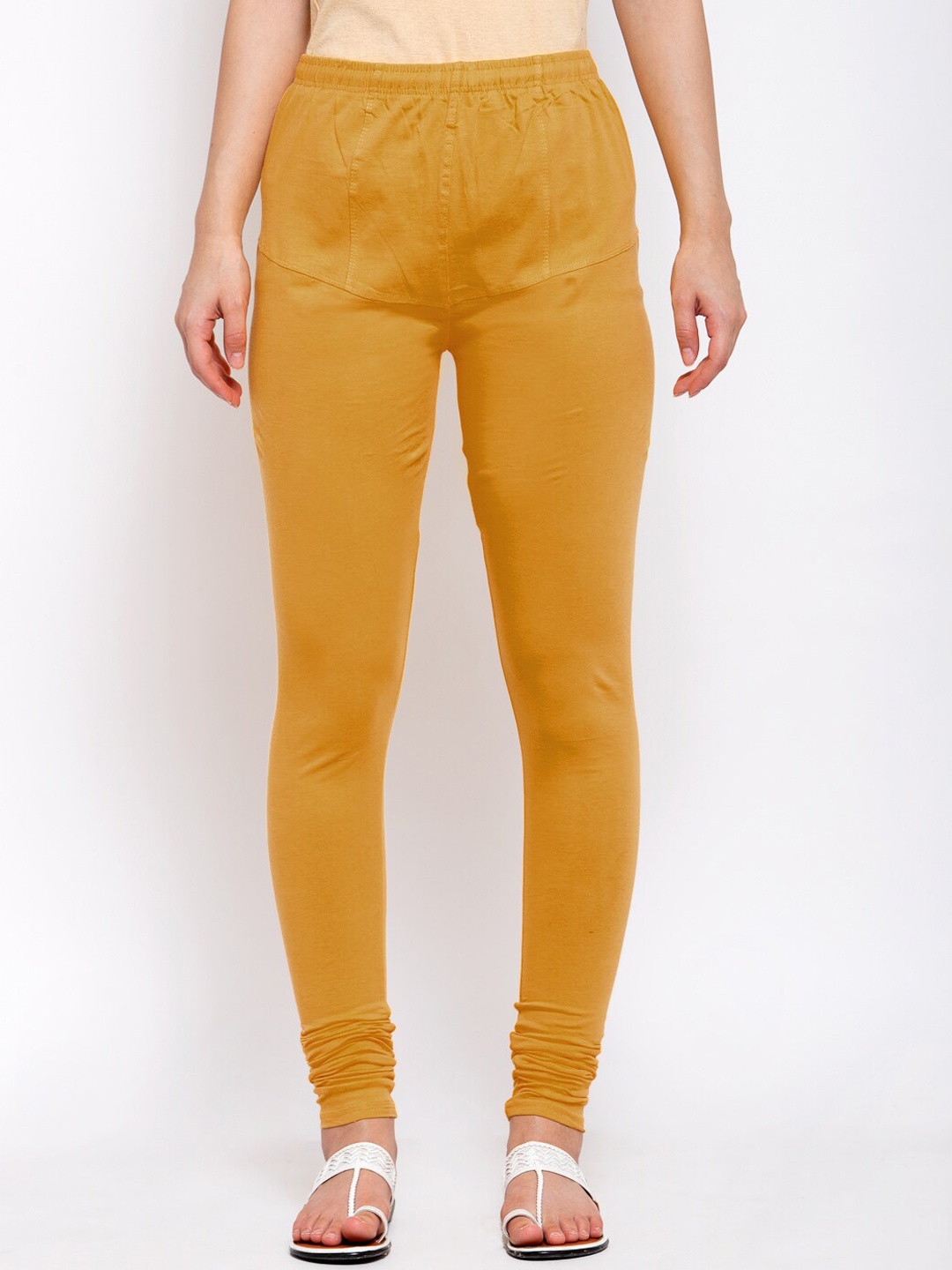 

Klotthe Women Mustard Solid Cotton Churidar- Length Leggings