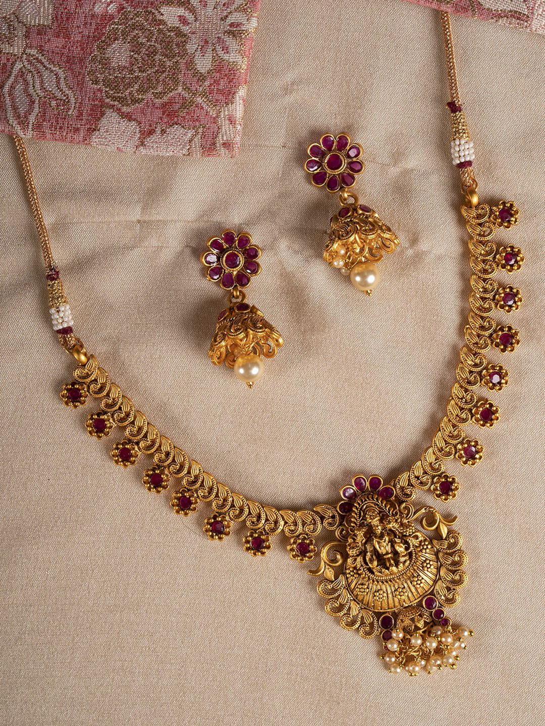 

Shoshaa Gold Plated Red Color Handcrafted temple Necklace and Earrings Set