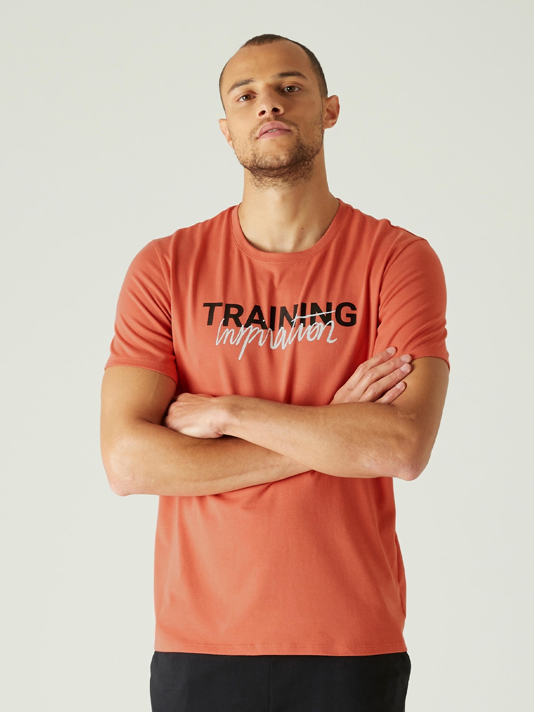 

NYAMBA By Decathlon Men Orange & Black Typography Printed Pilates T-shirt