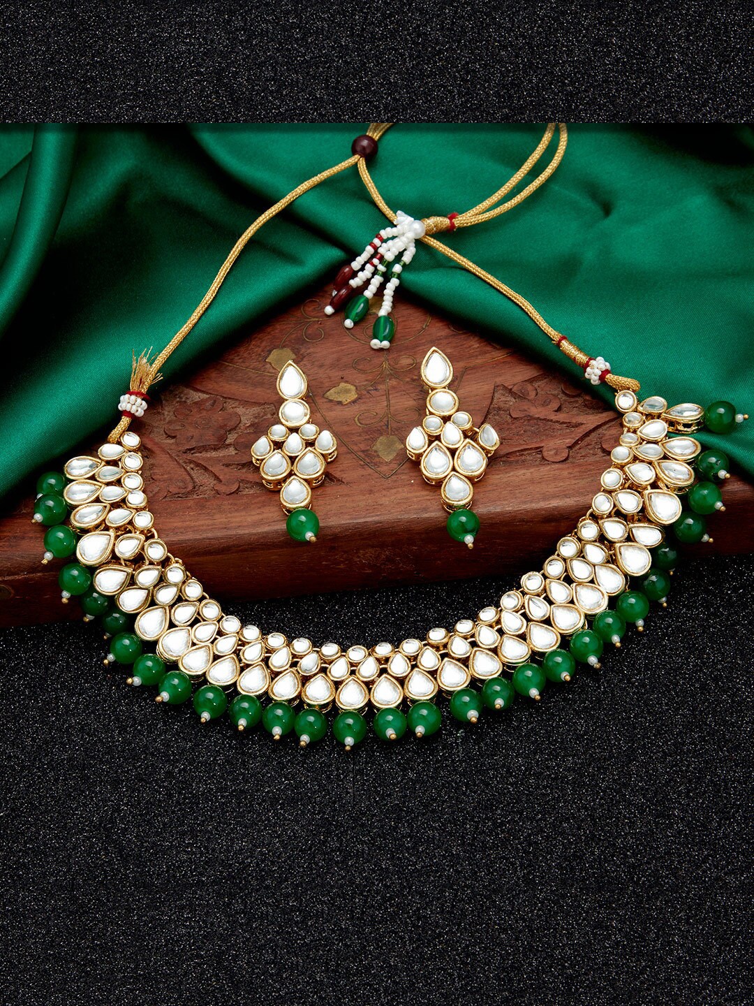 

Sukkhi Gold-Plated Green & White Kundan-Studded & Beaded Jewellery Set