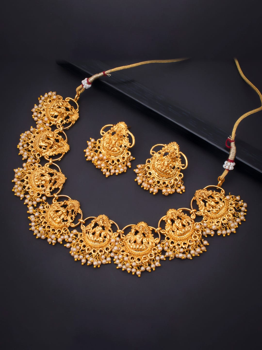 

Sukkhi Gold-Toned & Red Gold-Plated Stones & Pearl-Studded Temple Jewellery Set