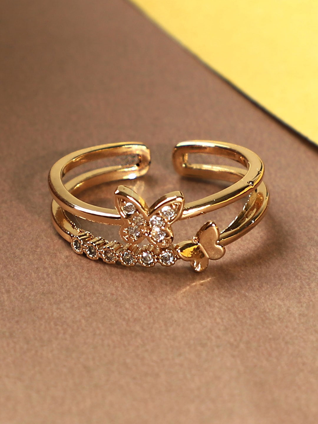 

ANIKAS CREATION Gold-Plated White Stone Studded Butterfly Shape Handcrafted Adjustable Finger Ring